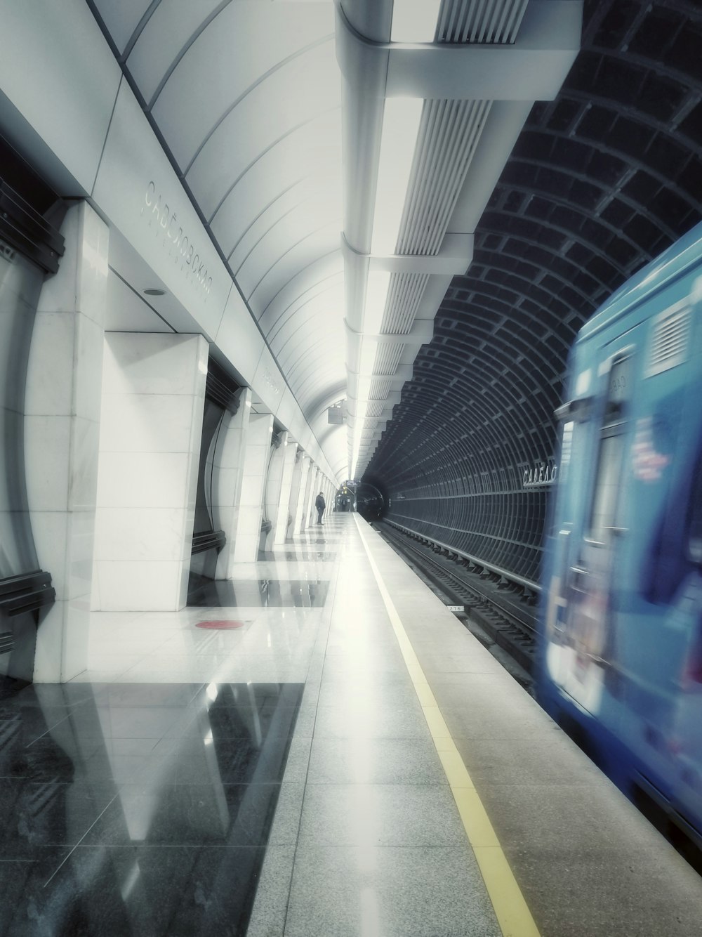 blue train in a tunnel