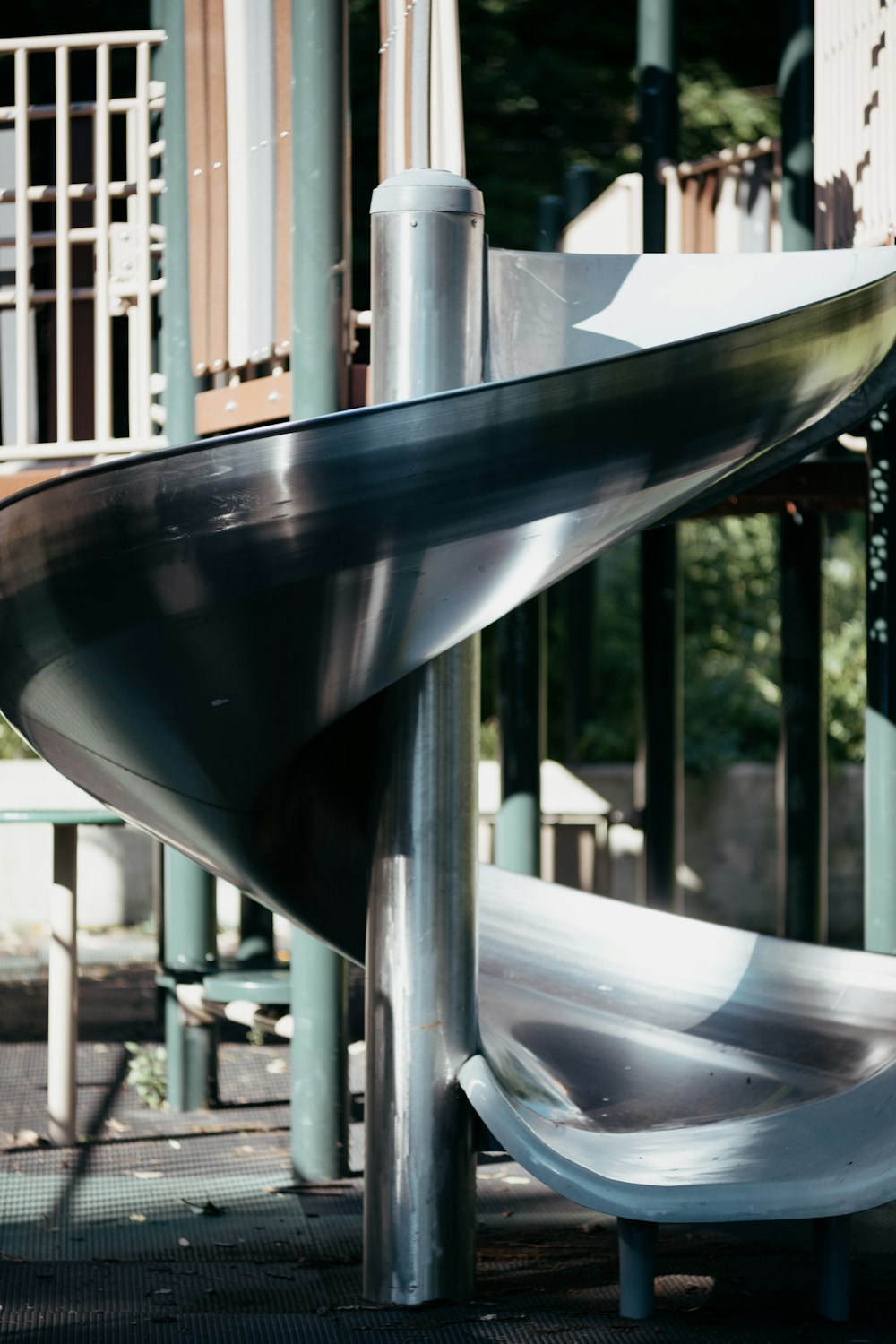 stainless steel railings near green trees during daytime