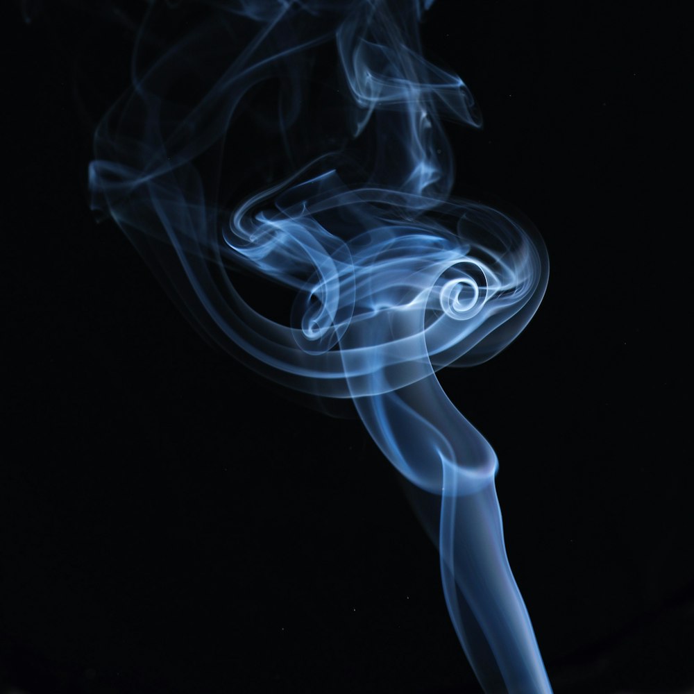 white smoke on black background