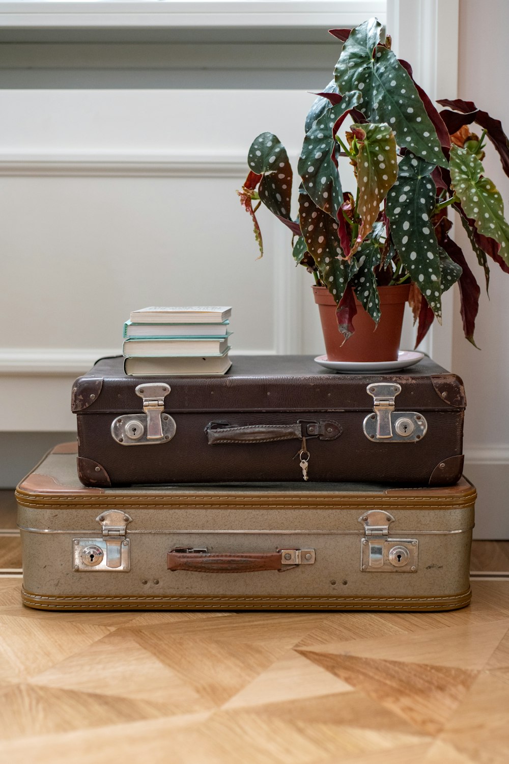 brown leather suitcase on brown wooden table