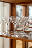 An assortment of glassware displayed elegantly on a shelf.