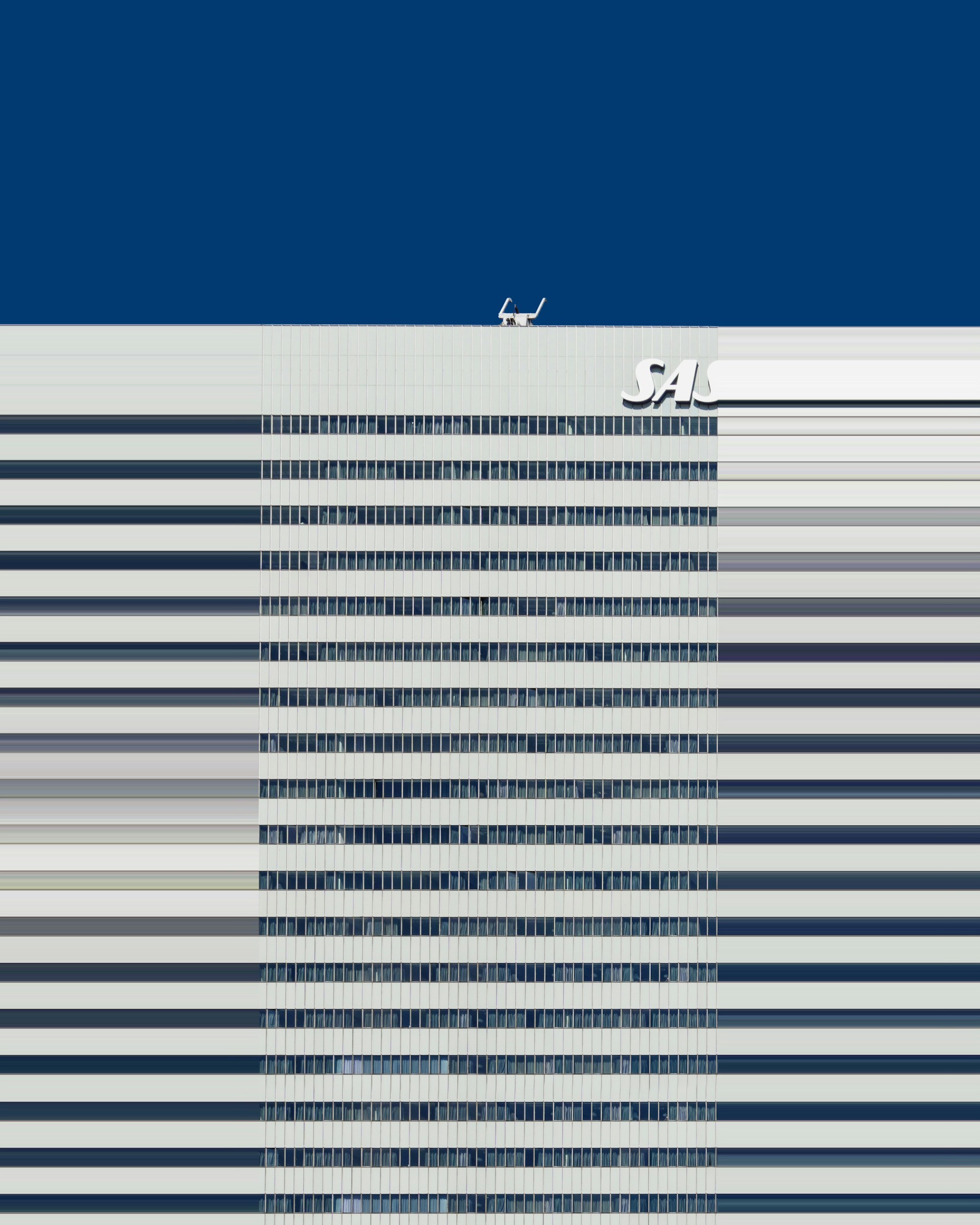 woman wearing yellow long-sleeved dress under white clouds and blue sky during daytime