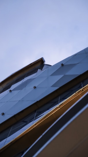 Modern industrial building facade showcasing sustainable construction materials in natural light.