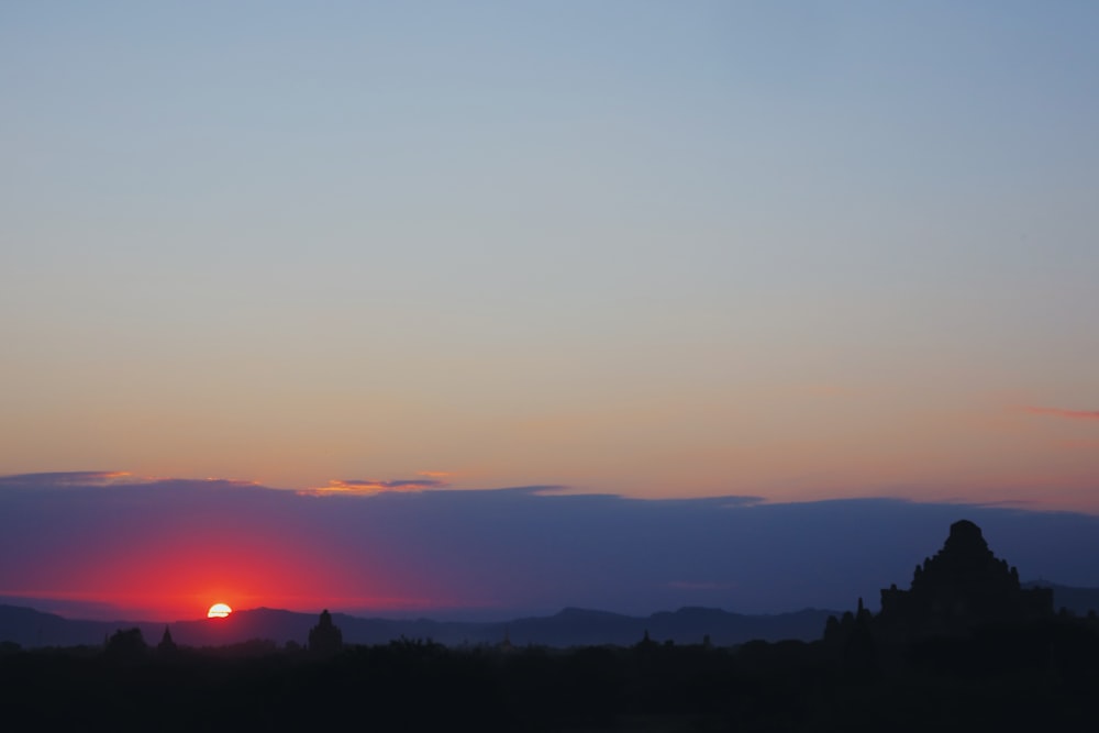 silhouette of trees during sunset