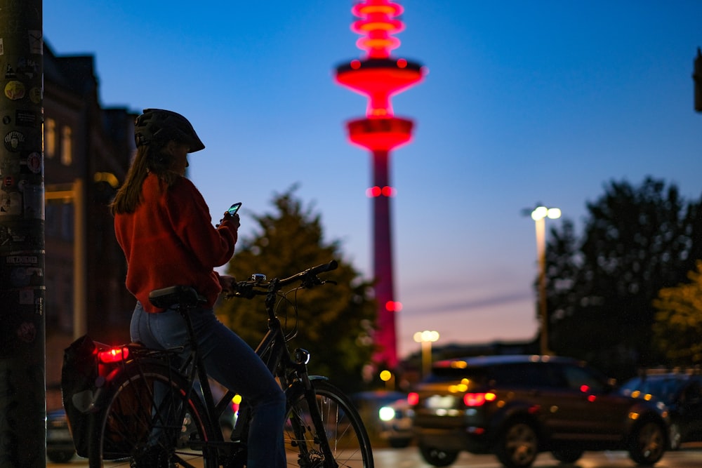 man in brown jacket riding bicycle during daytime