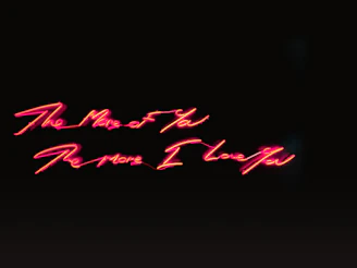 A chat interface glowing with neon purple and black, showing real-time messages.