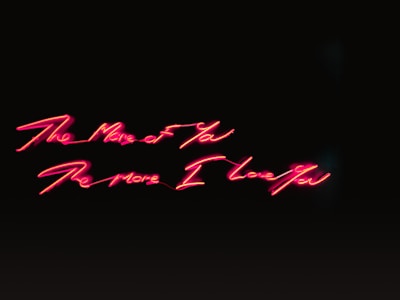 A sleek chat interface glowing in neon blue and pink, showing a conversation with pam.