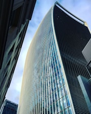 black and white glass walled high rise building