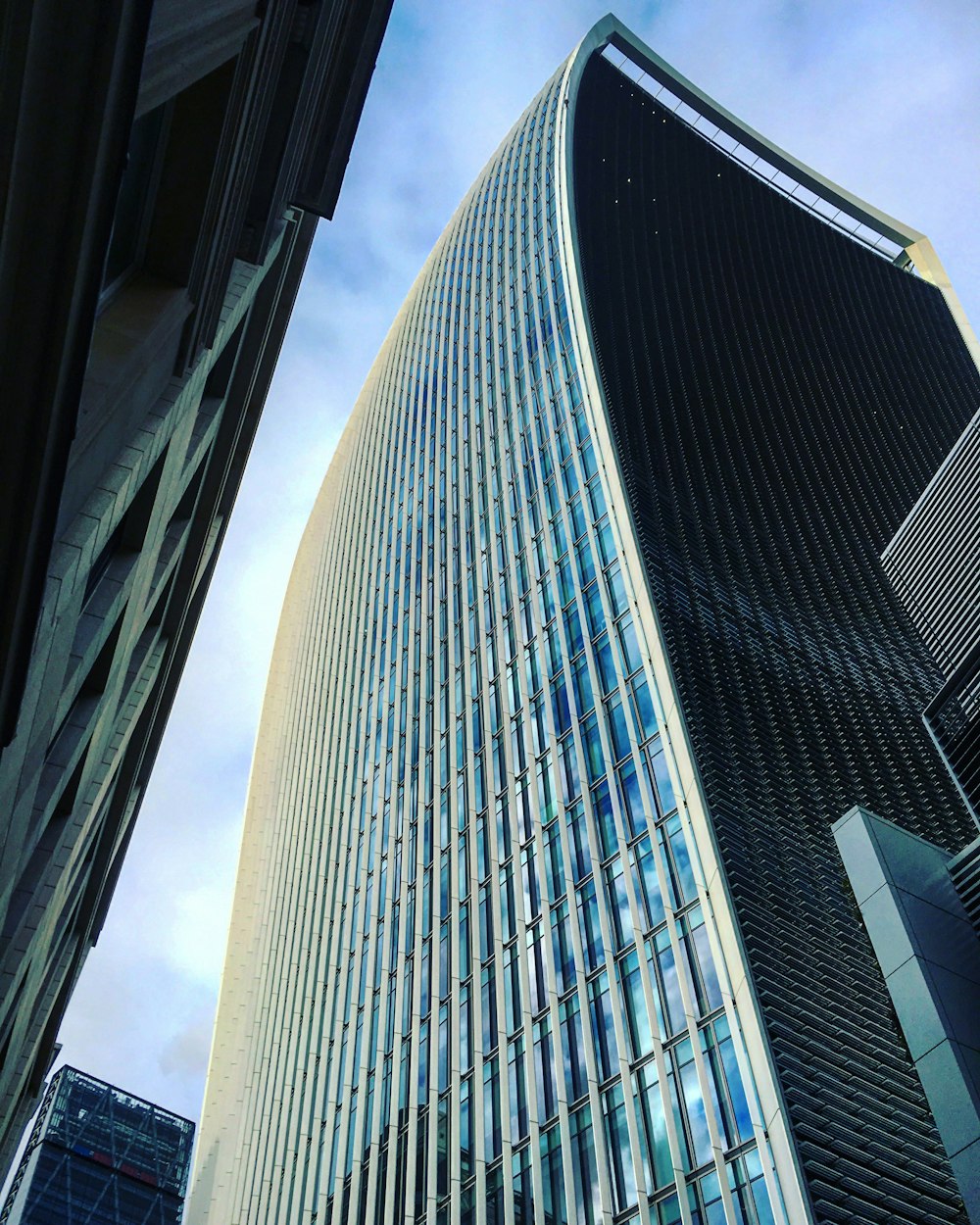 black and white glass walled high rise building