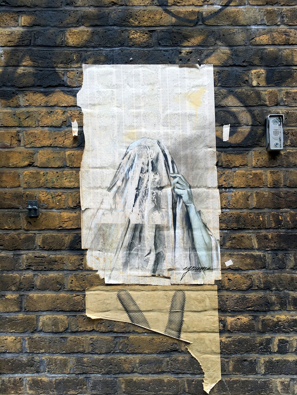 white textile on brown brick wall