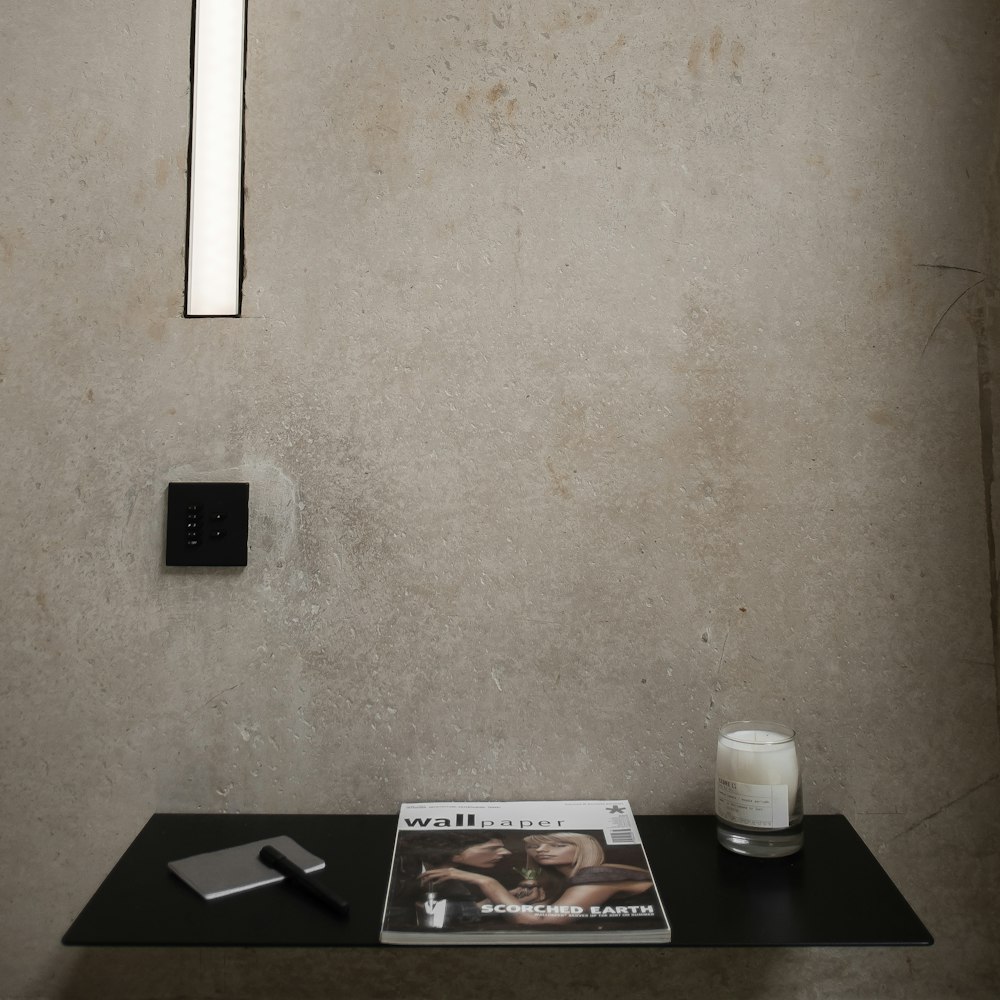 black wooden table with white ceramic mug on top