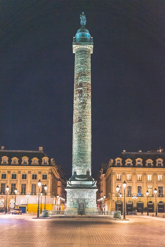 gray concrete tower during night time in Place Vendôme France