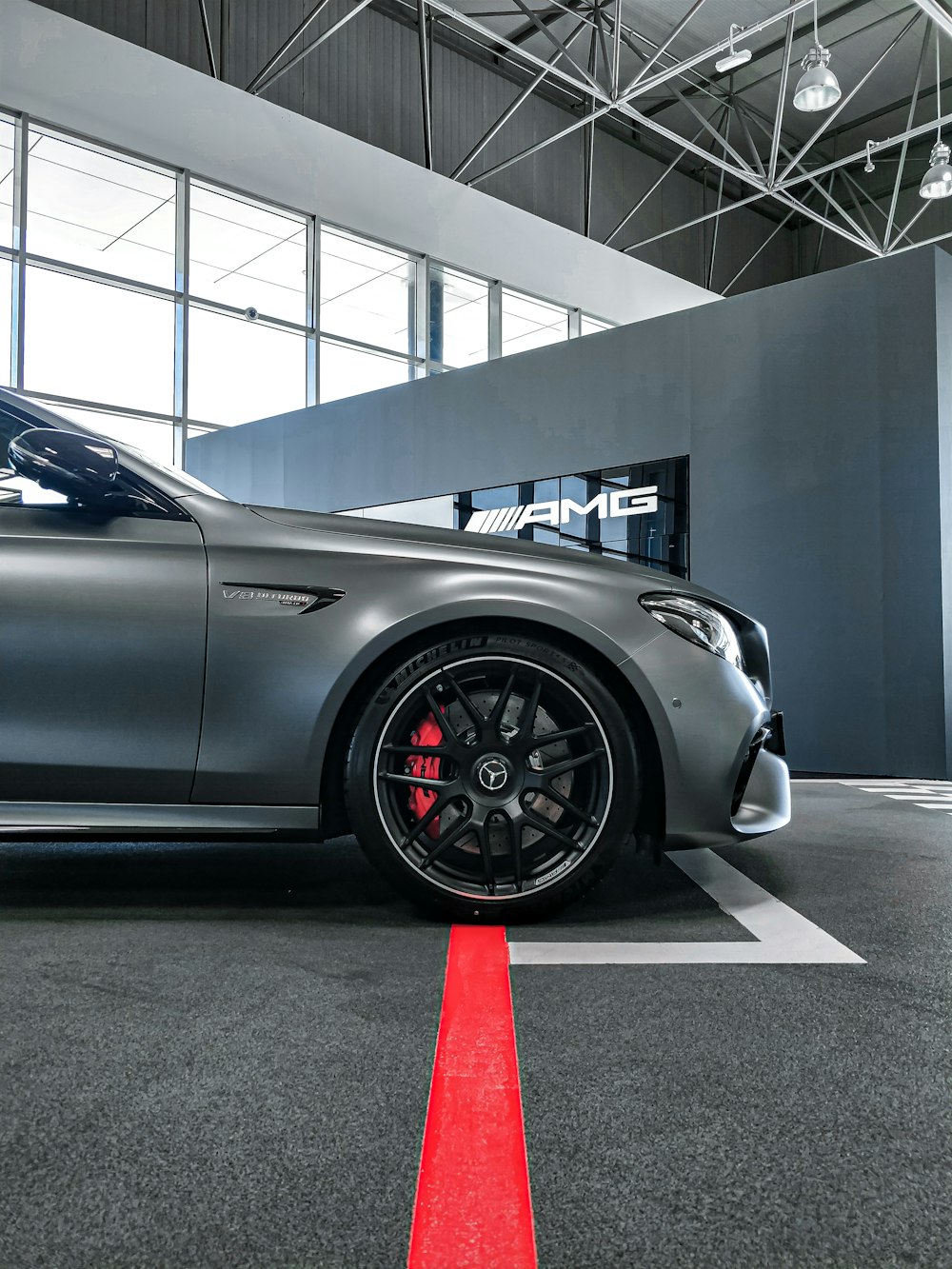 black coupe parked in a building