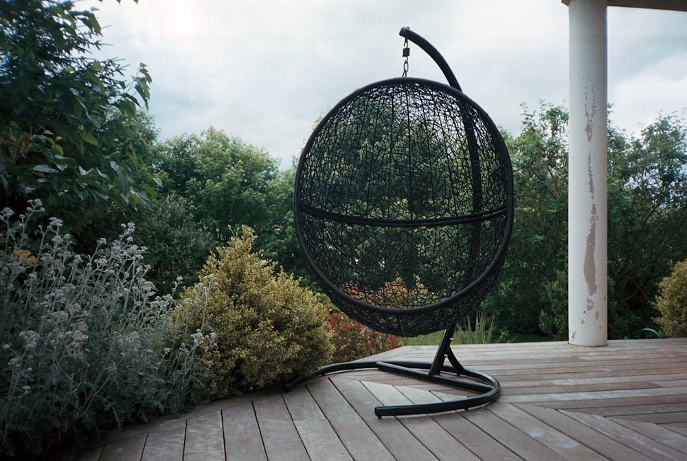 black round metal table near green trees during daytime