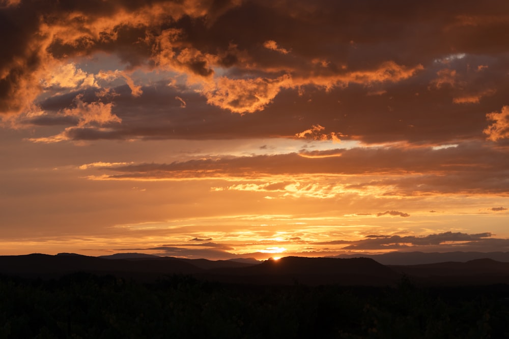 silhouette of mountains during sunset