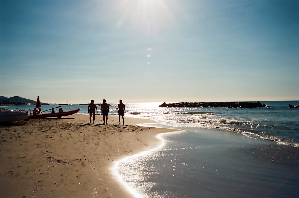 people walking on beach during daytime