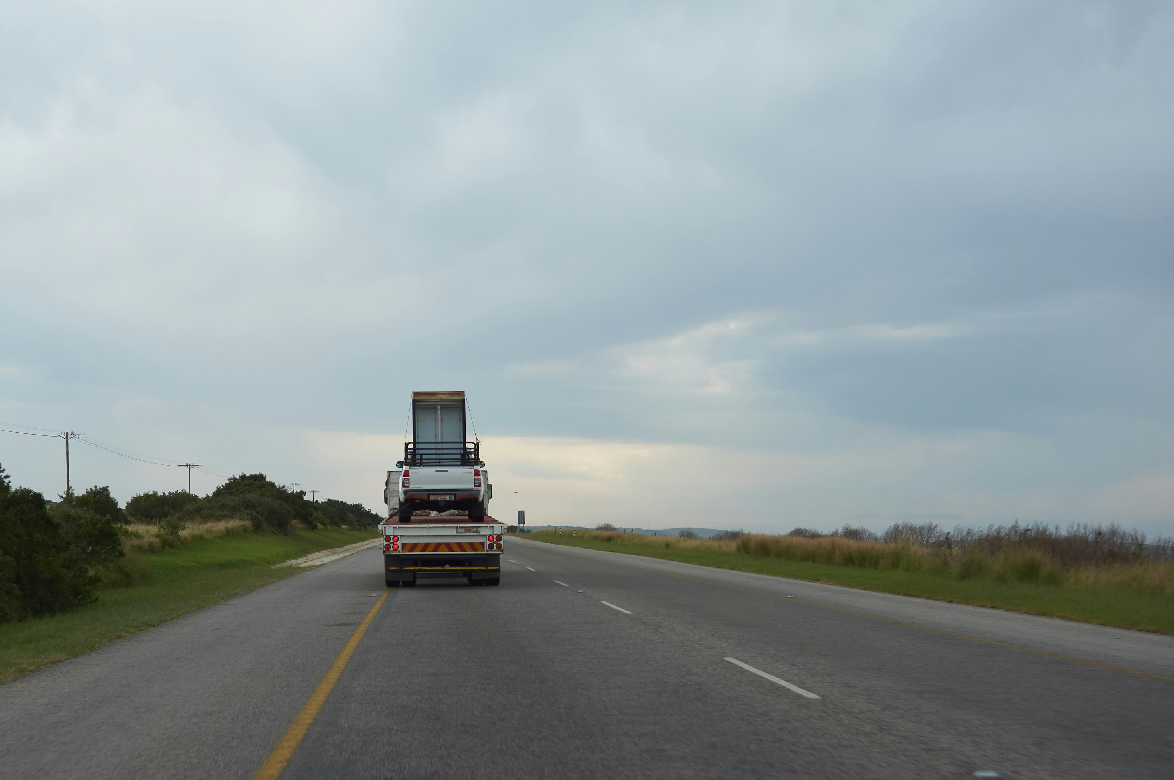 black and yellow truck on road during daytime