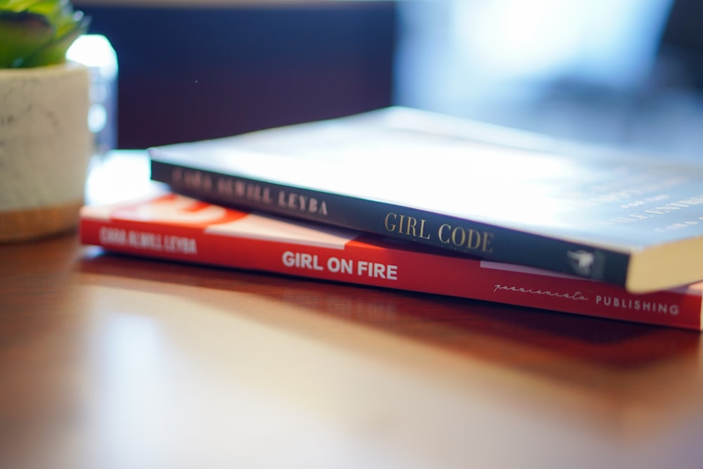 red and white book on white table