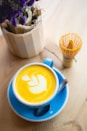 white ceramic cup with cappuccino