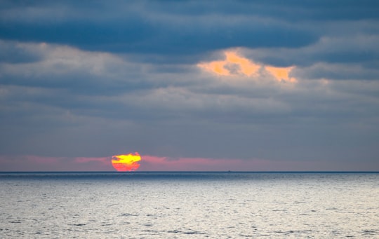 body of water under cloudy sky during sunset in Tijuana Mexico