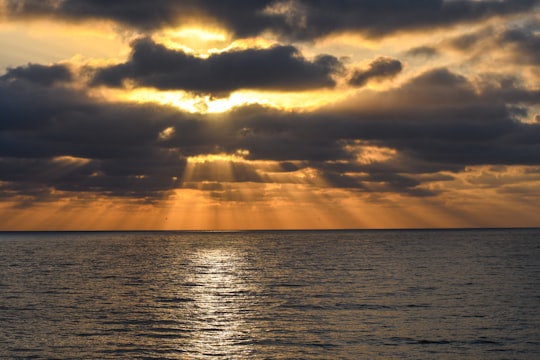 body of water under cloudy sky during sunset in Tijuana Mexico