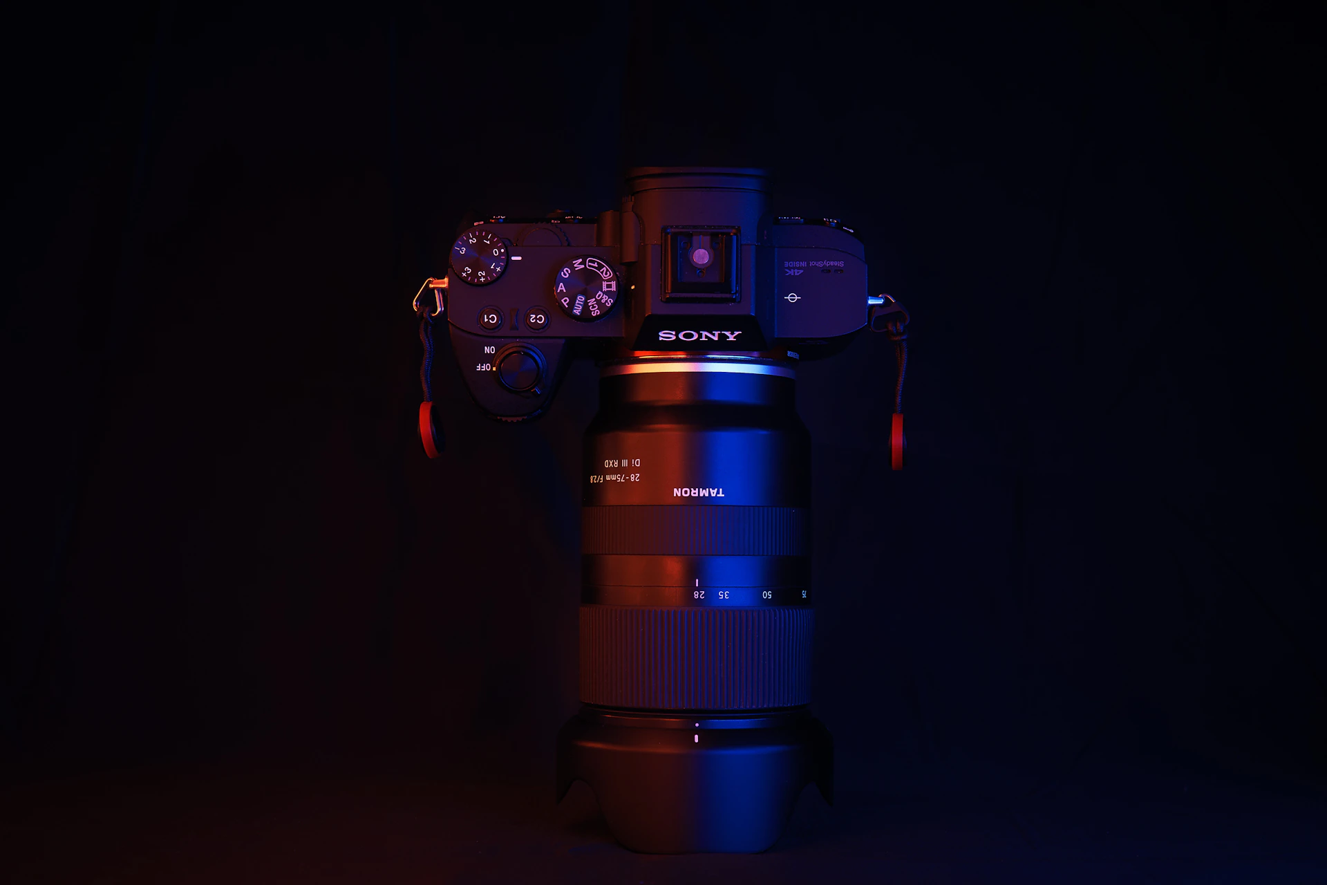 black nikon dslr camera on black surface