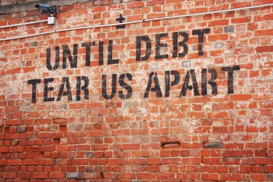 a brick wall with a message written on it