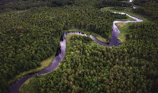 Aerial view of a river winding through lush Brazilian forest