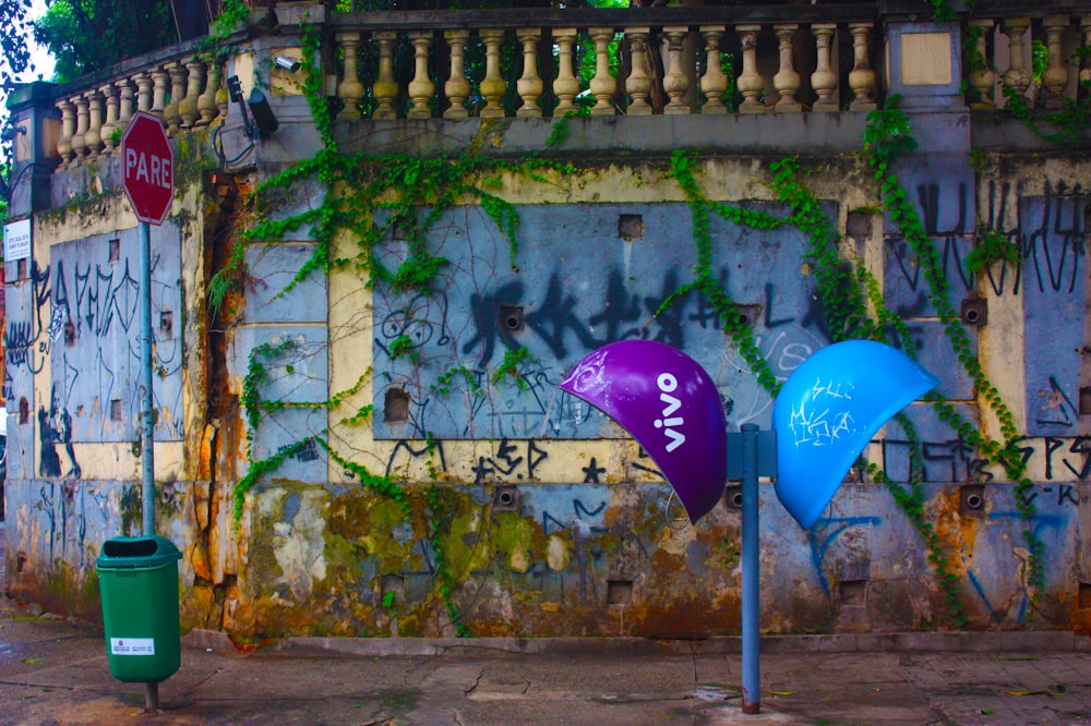 green blue and yellow umbrella on wall