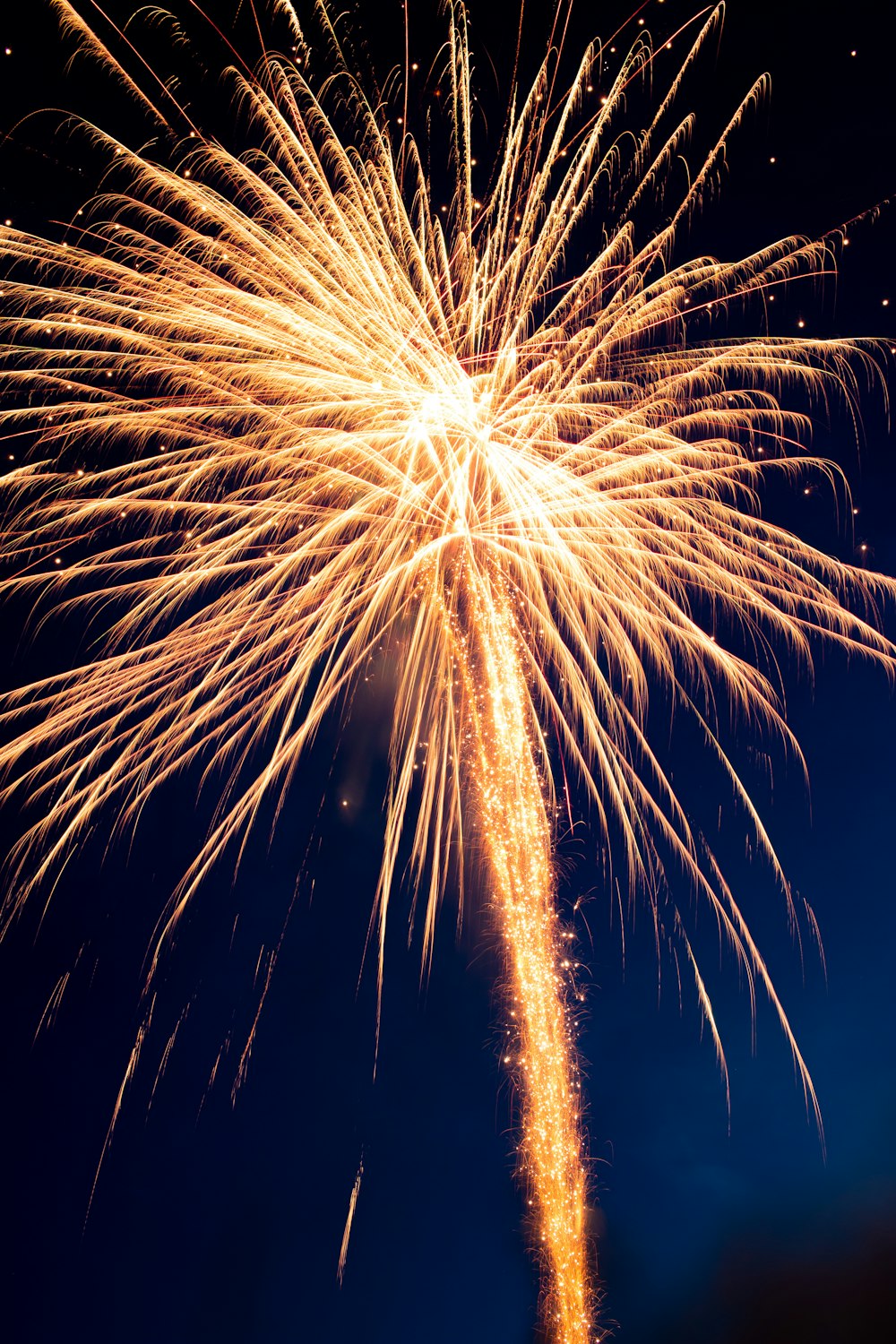 yellow fireworks in the sky during night time