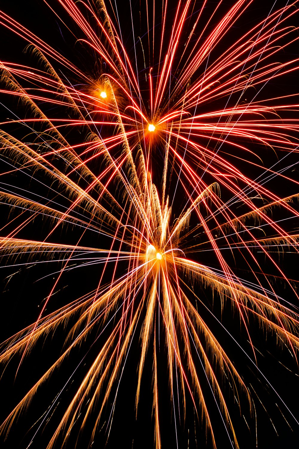 yellow fireworks in the sky during night time