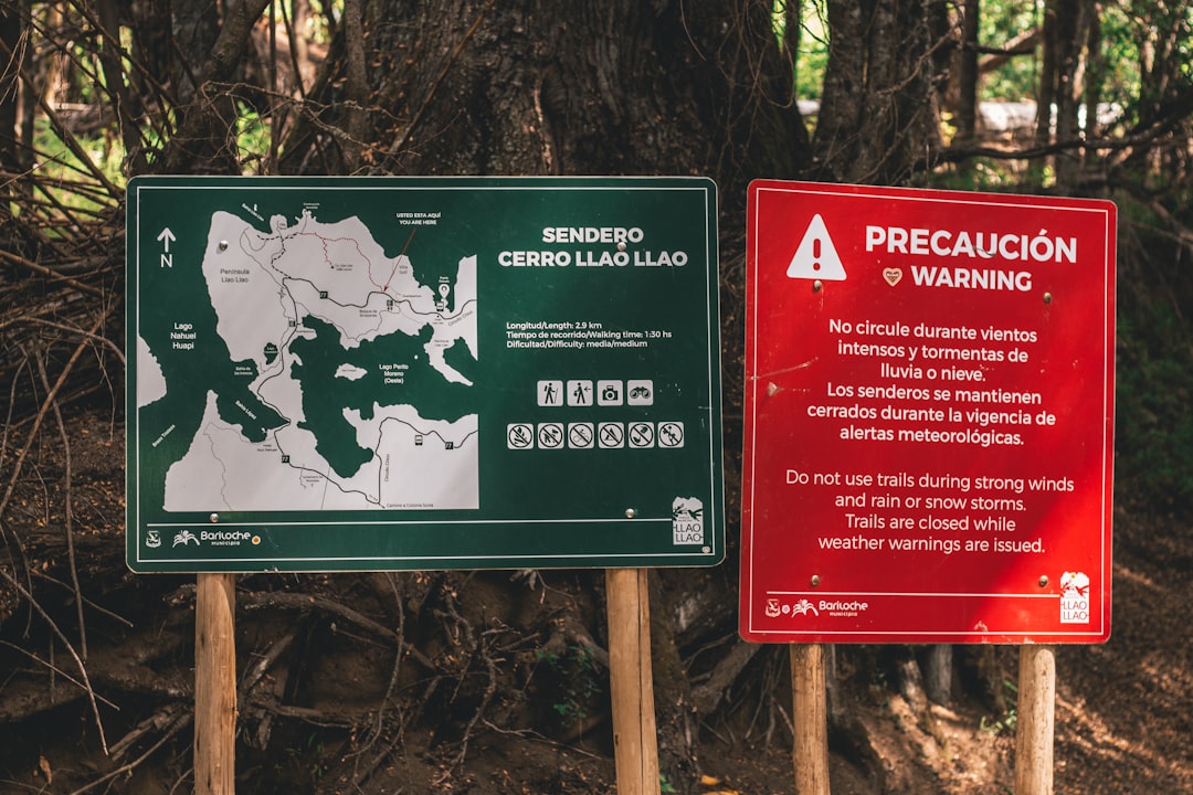 green and white wooden signage