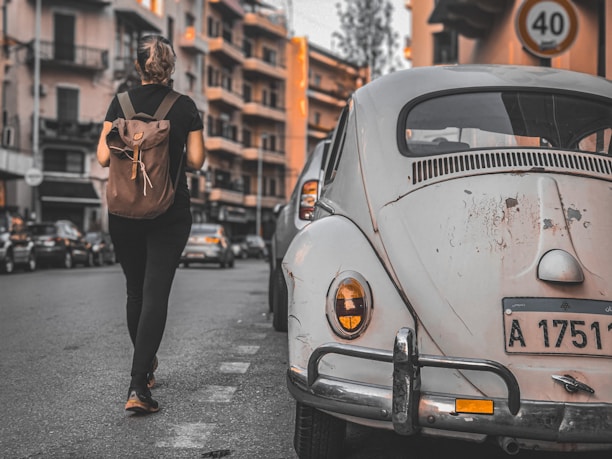 A happy customer wearing the backpack comfortably while walking through a city street.