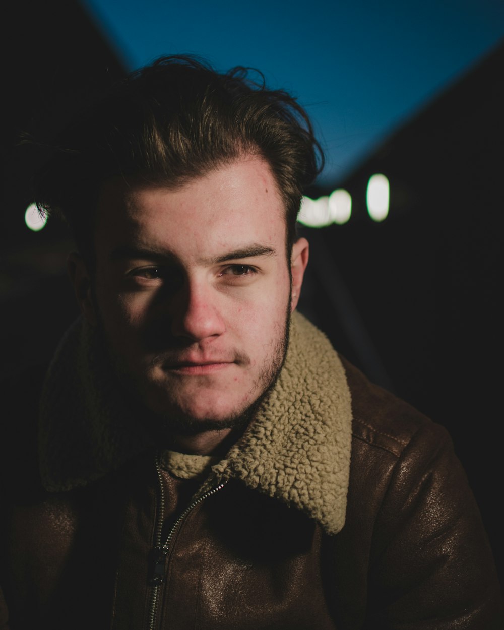 man in brown zip up jacket