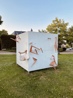 An outdoor scene with cube's durable goods packed for a day of modern, minimalist adventure.