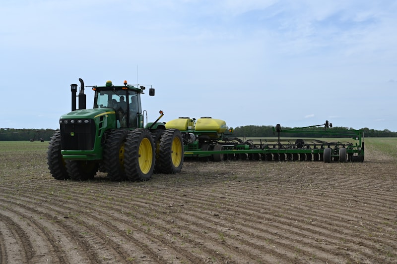Green tractor in field