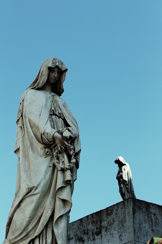 woman in white dress statue in Cementerio de la Recoleta Argentina
