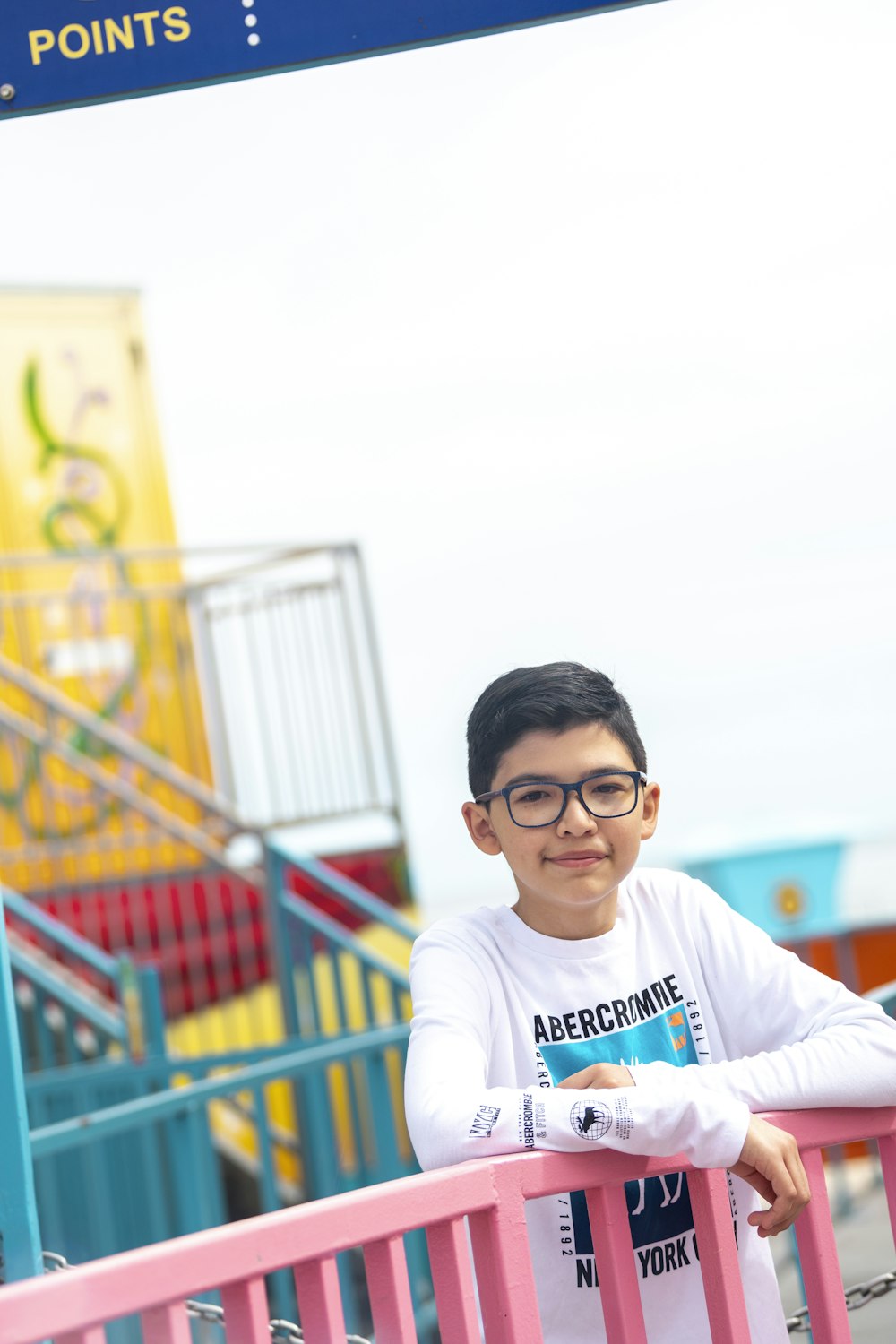 man in white crew neck t-shirt wearing black framed eyeglasses