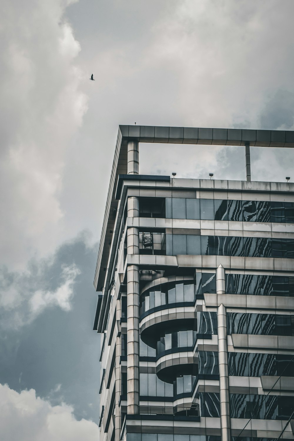 white concrete building under cloudy sky during daytime