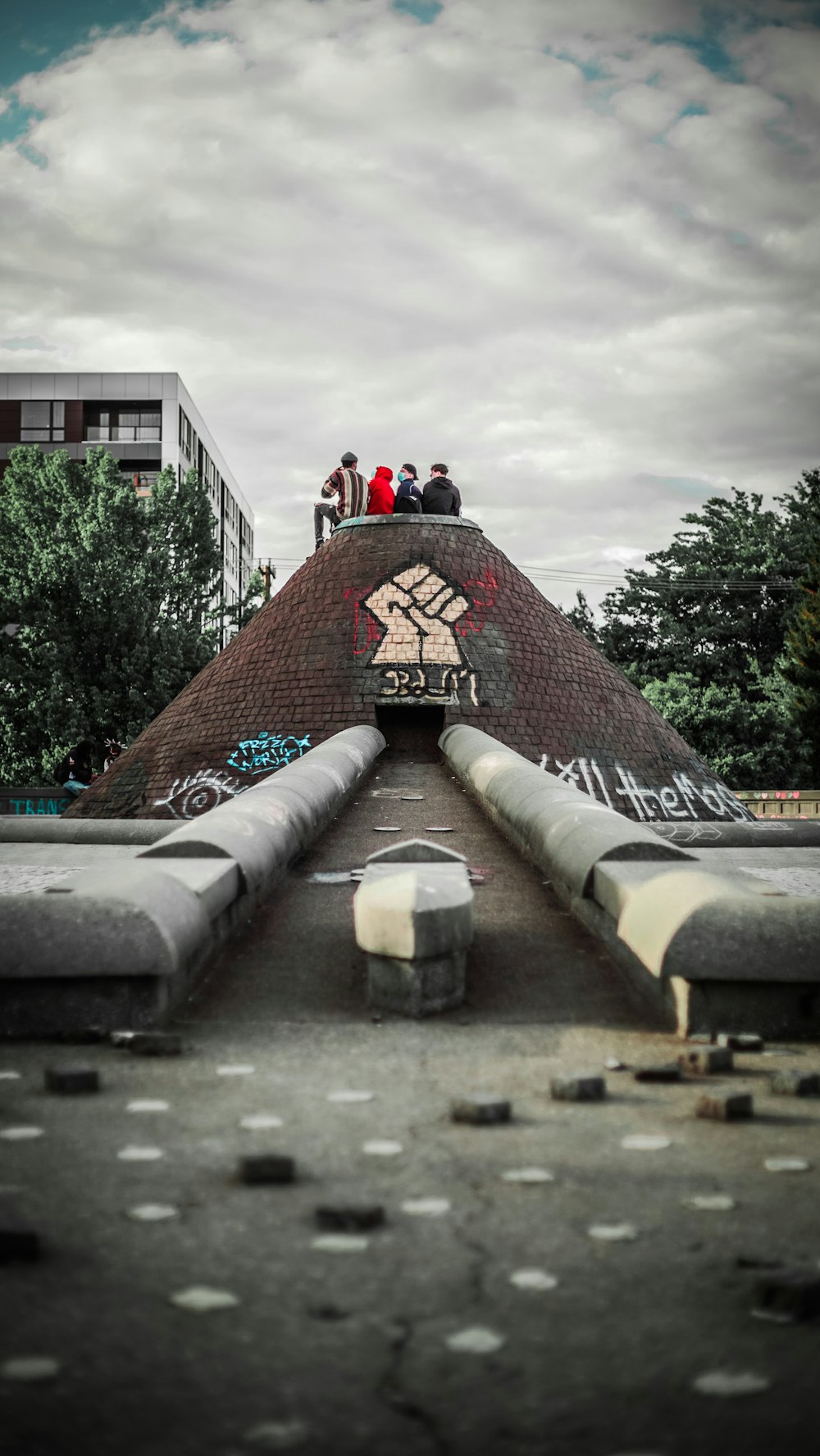 people walking on brown concrete stairs during daytime