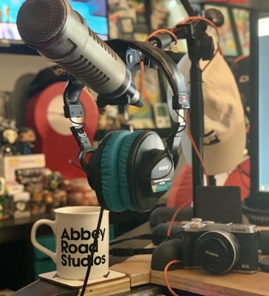 black and blue headphones beside black headphones