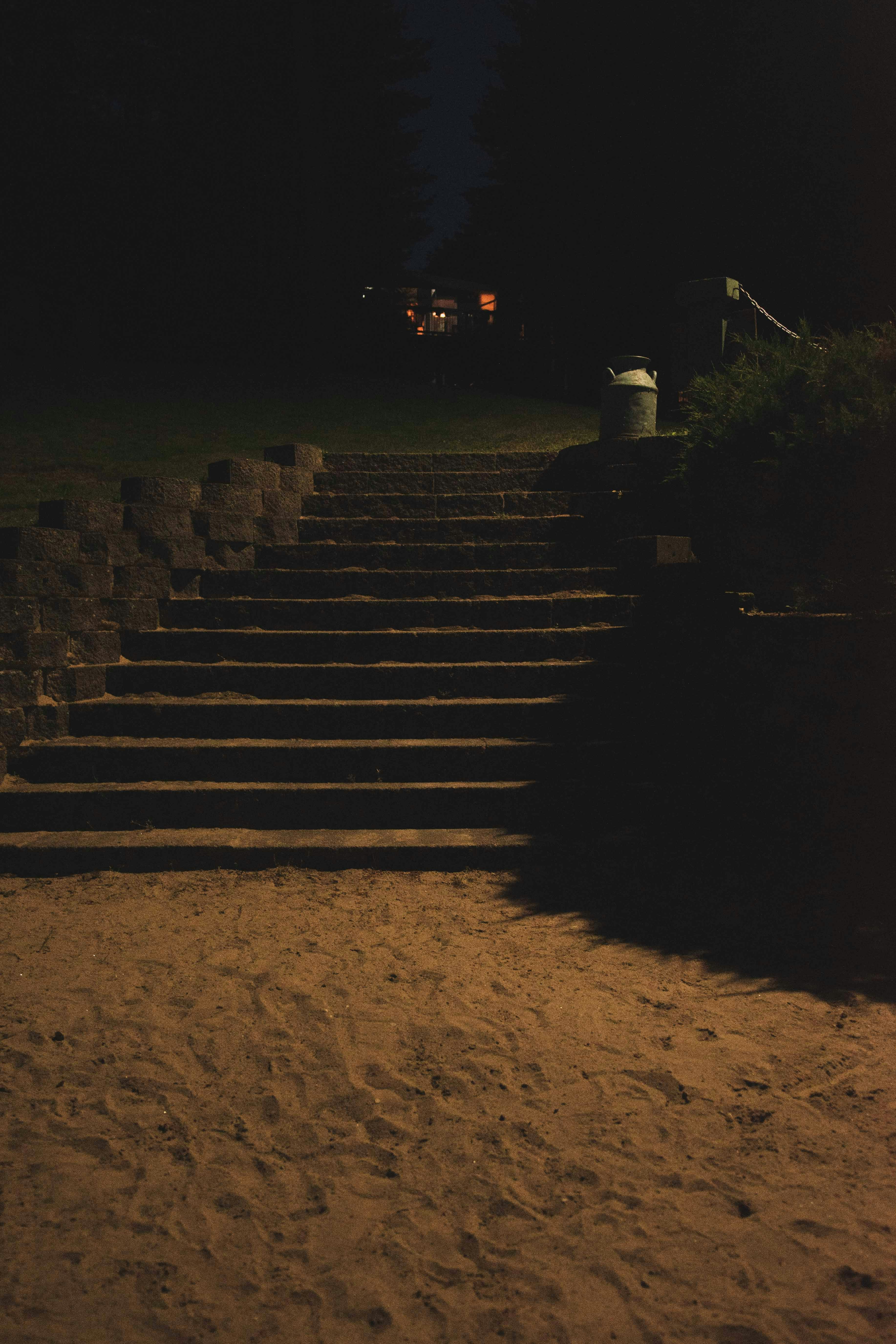 Black concrete stairs during night time photo – Free Dam lake Image on