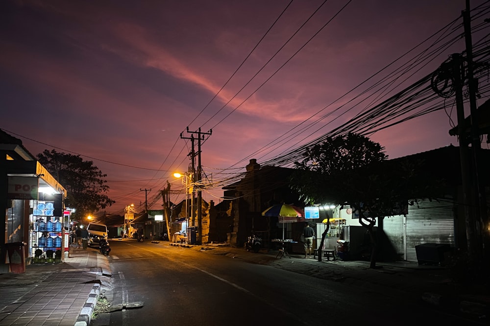 cars parked on side of the road during night time