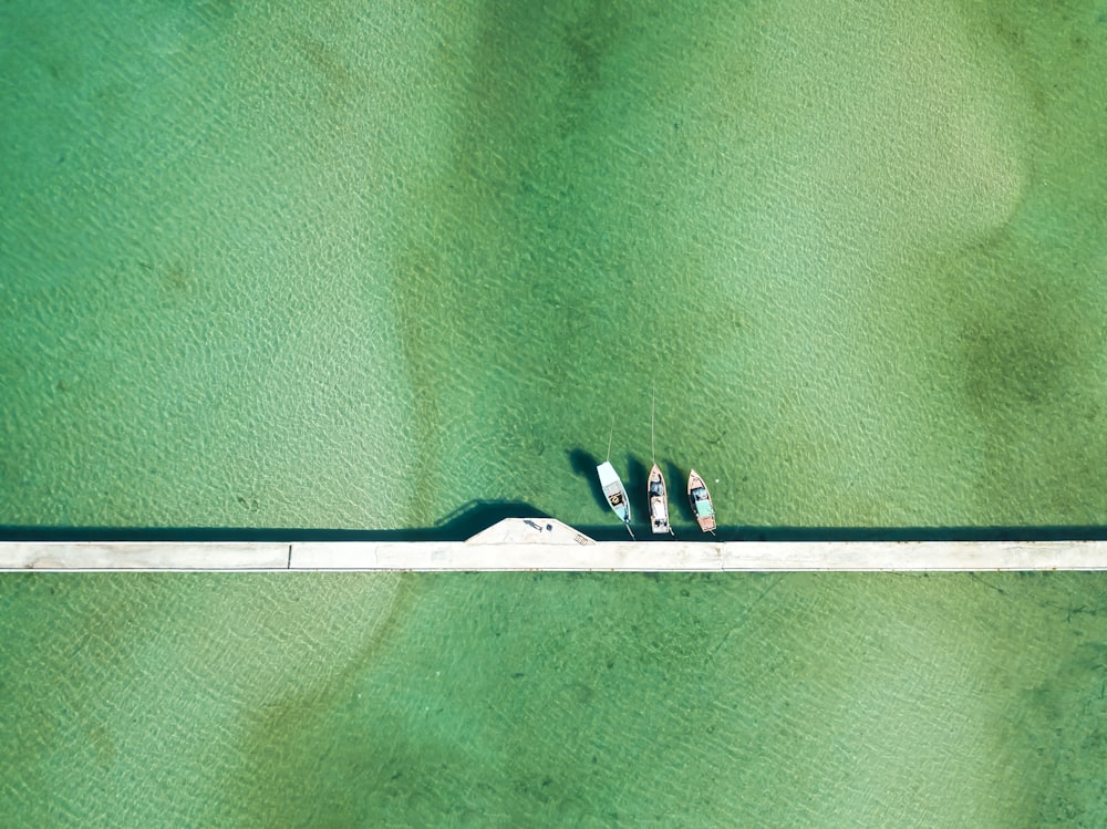 white boat on body of water during daytime