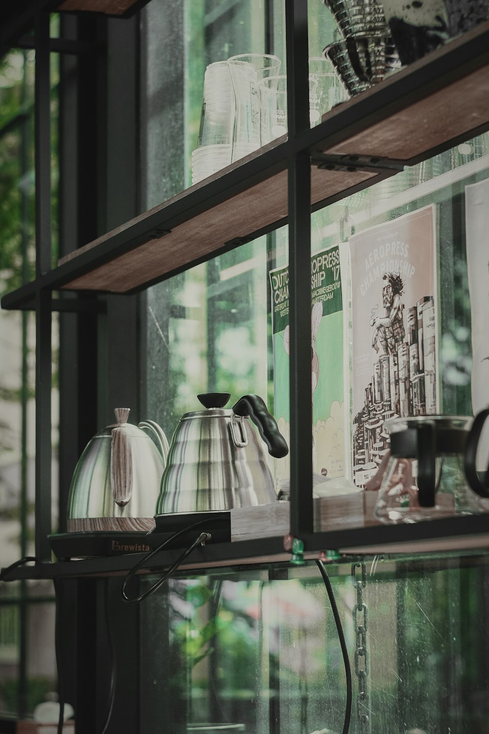 black and silver electric kettle on green table