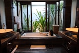 A modern bathroom with high-end fixtures in the deluxe room.