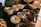 Close-up of assorted dry fruits and spices beautifully arranged on a rustic wooden table.