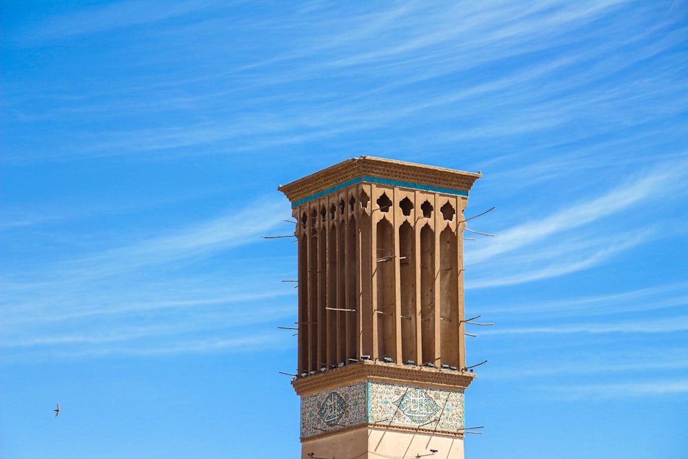 brown wooden arch under blue sky during daytime