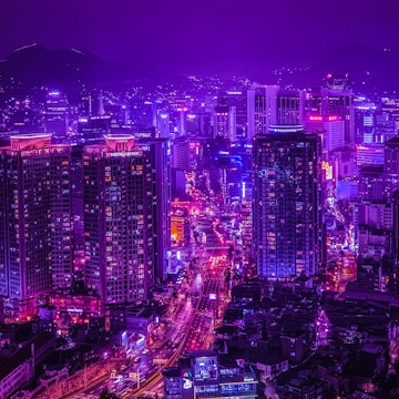 A 3D animated futuristic city skyline illuminated by neon purple and violet lights under a dark sky.