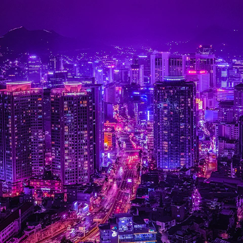 A sleek neon-lit cityscape in purple, pink, and blue hues embodying a futuristic cyberpunk vibe.